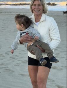 Polli carrying Logan in the sand 1