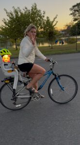 Polli riding next to the lake with Logan