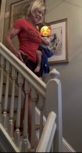 Polli with Logan going down stairs better
